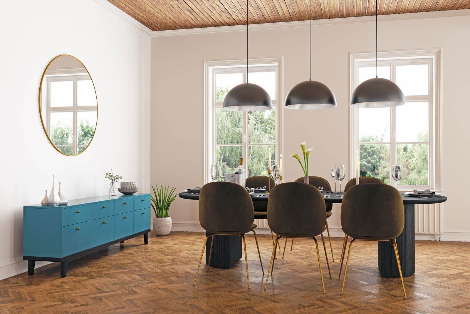 Modern dining room with dark chairs and pendant lights.