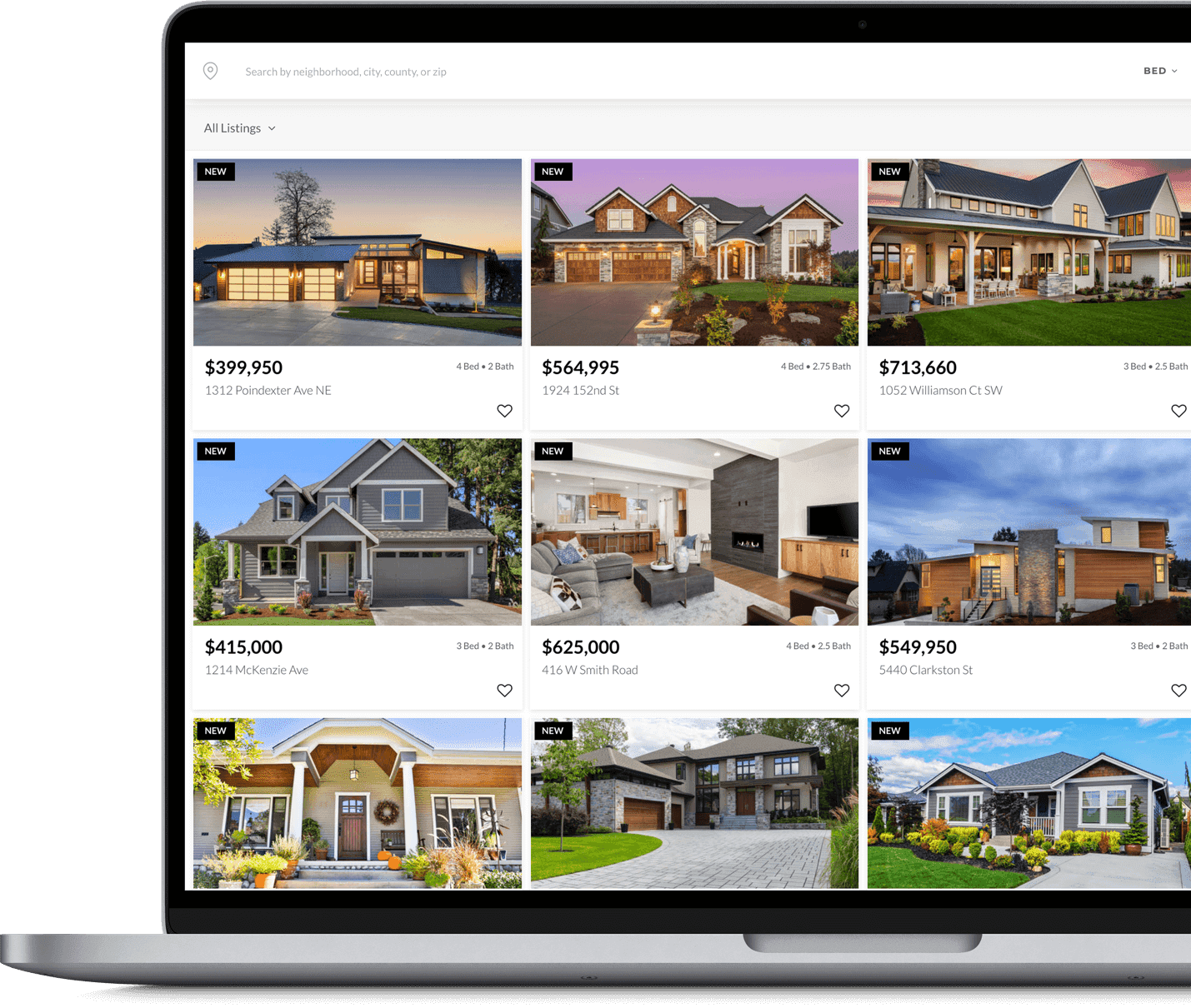 A laptop screen displaying a real estate website with various home listings and prices.